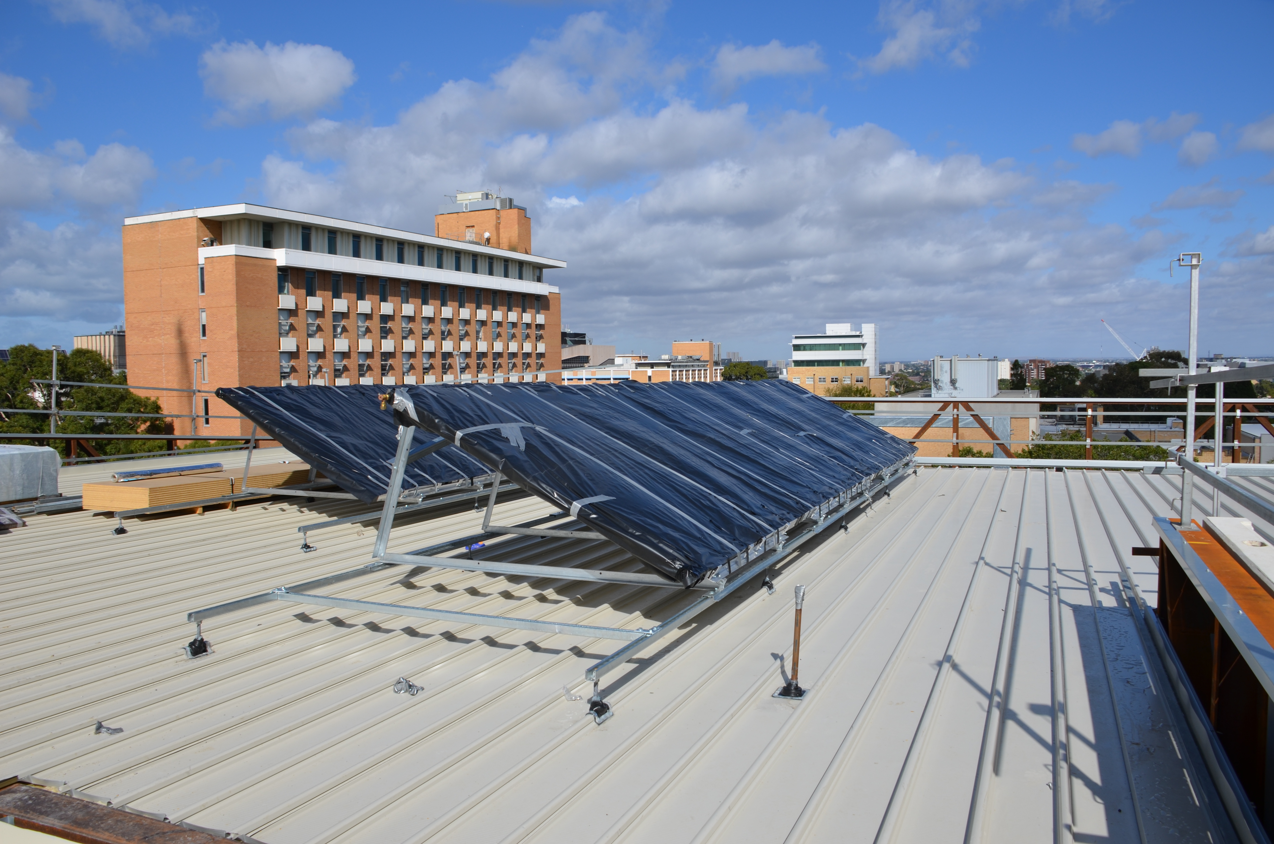 https://archive.abp.unimelb.edu.au/objects/images/Construction/Images/Services/Solar roof panels/DSC_5434.JPG