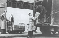 Delivery of boxes from a truck [English Registration Plate AXX 943]