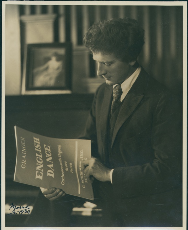 Percy Grainger holding a copy of ‘English Dance’, 1929
