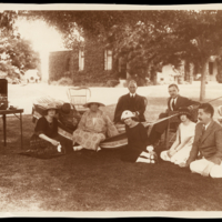 Nellie Melba (on hammock), John Lemmoné (centre back) and friends with a portable gramophone, Coombe Cottage, late 1920s