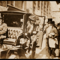 Nellie Melba alighting from her car with driver William Hayes, London, c.1900–10