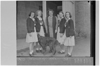 Group of four senior students with their headmistress, St Catherine's, Waverley (interviewee not pictured), 1 November 1945. Photographer Sam Hood. State Library New South Wales, Home and Away–11349.jpg